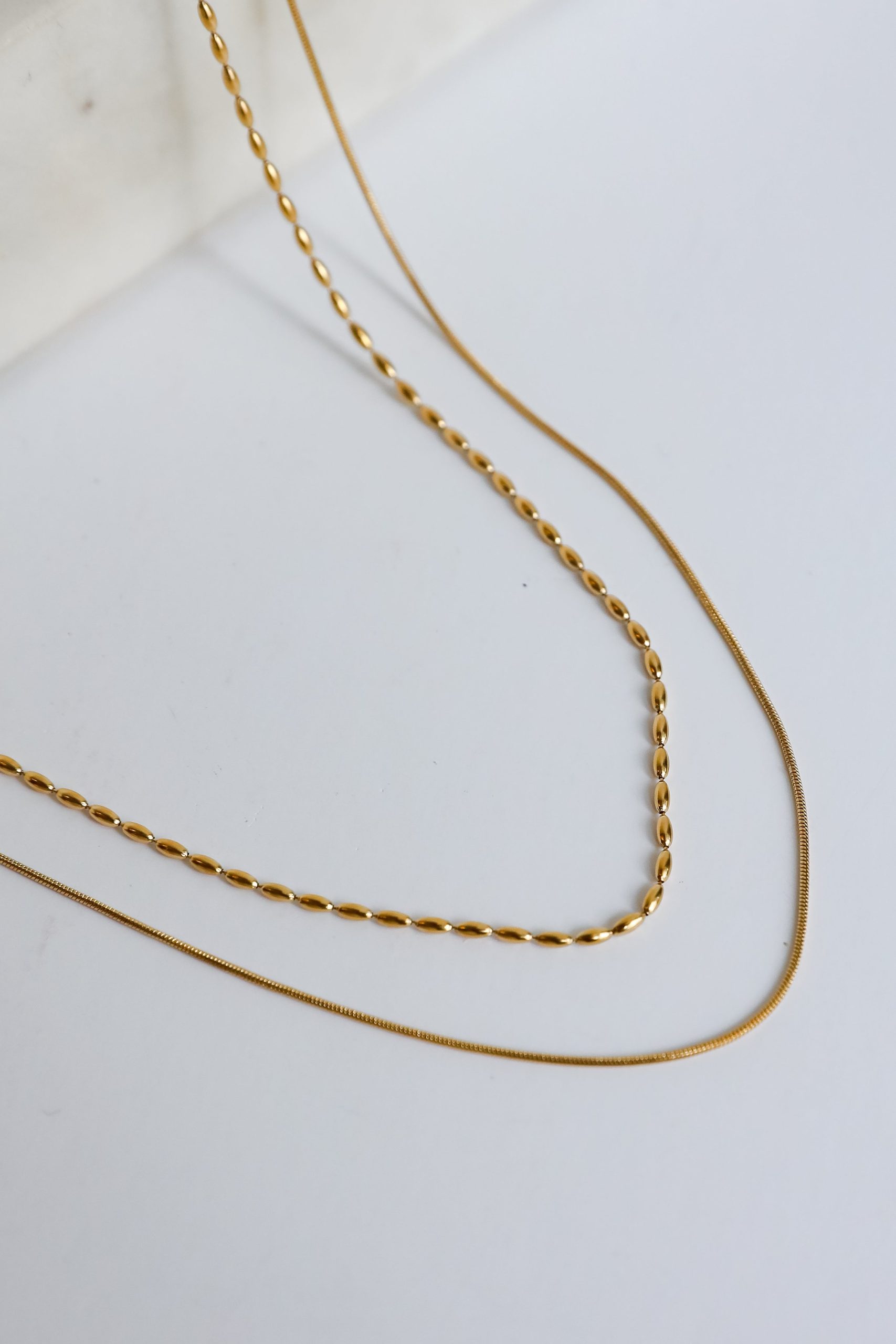 shopdressup_gold_layered_necklace-4_6ec04b22-be2b-4bd9-8ab3-68ea2001bd94.jpg