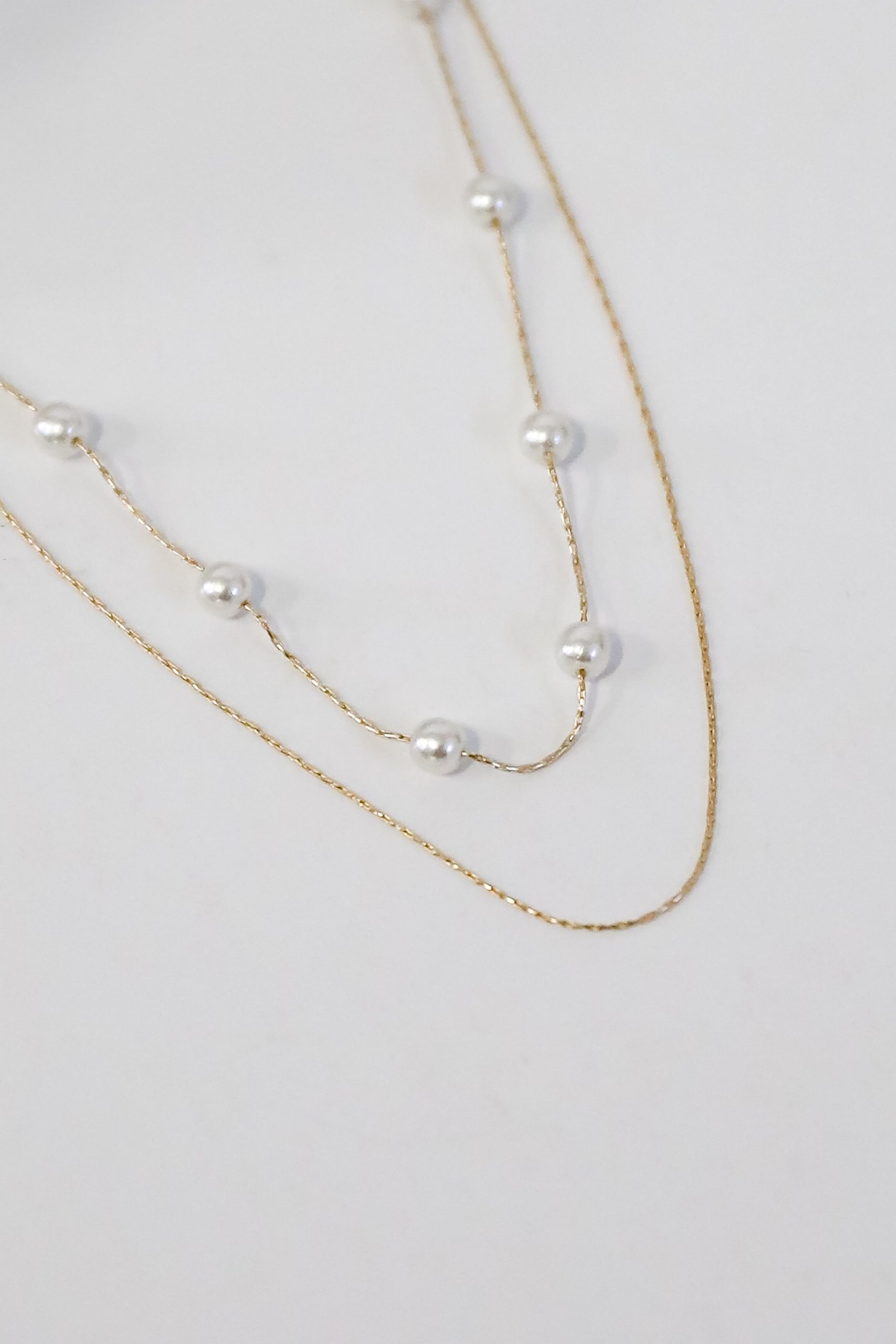 shopdressup_gold_pearl_layered_necklace-4_f7dc0920-18d6-4082-9be7-7b9009c77b7a.jpg